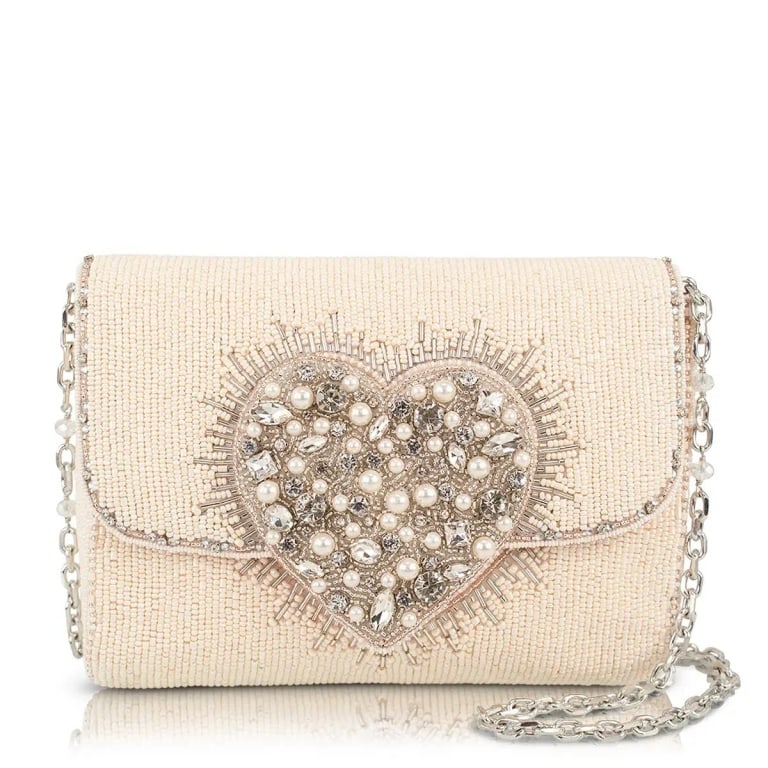 NEW MARY FRANCES LOVE ILLUMINATED BAG: Some hearts are meant to shine. Love Illuminated features a dazzling crystal and pearl silver heart that lights up a classic ivory handbag with effortless elegance. Beautifully understated yet impossi