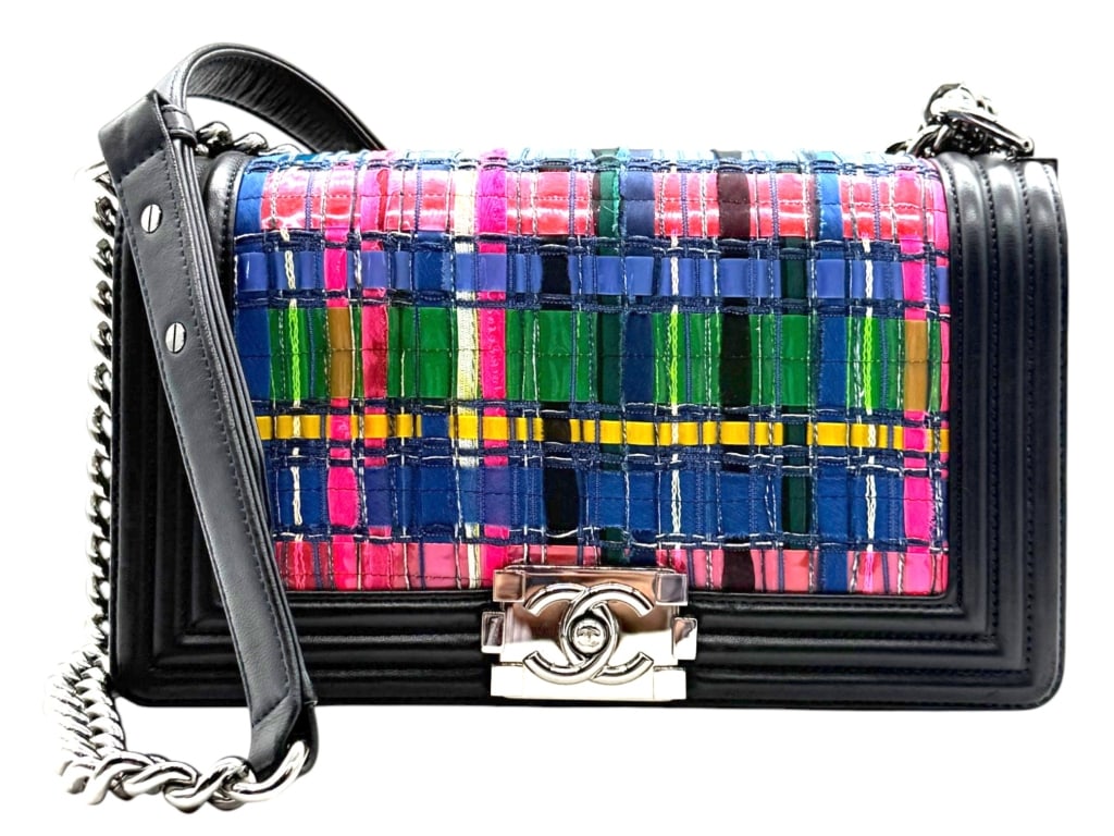 CHANEL BOY BAG PLAID RIBBON FLAP 10": A highly distinctive Chanel Boy Flap Bag featuring an intricate woven plaid ribbon panel in vibrant shades of navy, pink, green, yellow, black, and red, framed by smooth black leather and polished sil