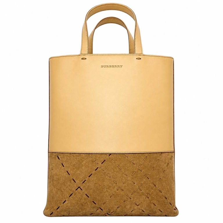 BURBERRY LEATHER SUEDE TOTE BAG 16": Vintage Burberry London two-tone tote crafted with a smooth beige leather upper and taupe suede lower panel featuring decorative contrast stitched detailing inspired by the Burberry check. Tall struct