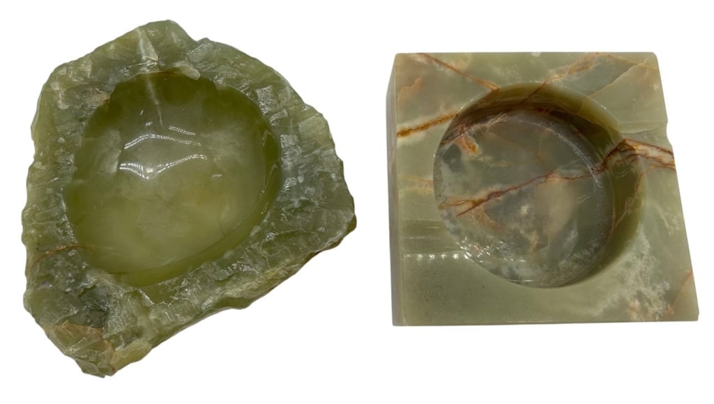PAIR GREEN ONYX STONE ASHTRAYS 7": Decorative pair of vintage green onyx stone ashtrays, each showcasing the naturally occurring translucent coloration, veining and mineral variations characteristic of onyx. Includes one substantial sq