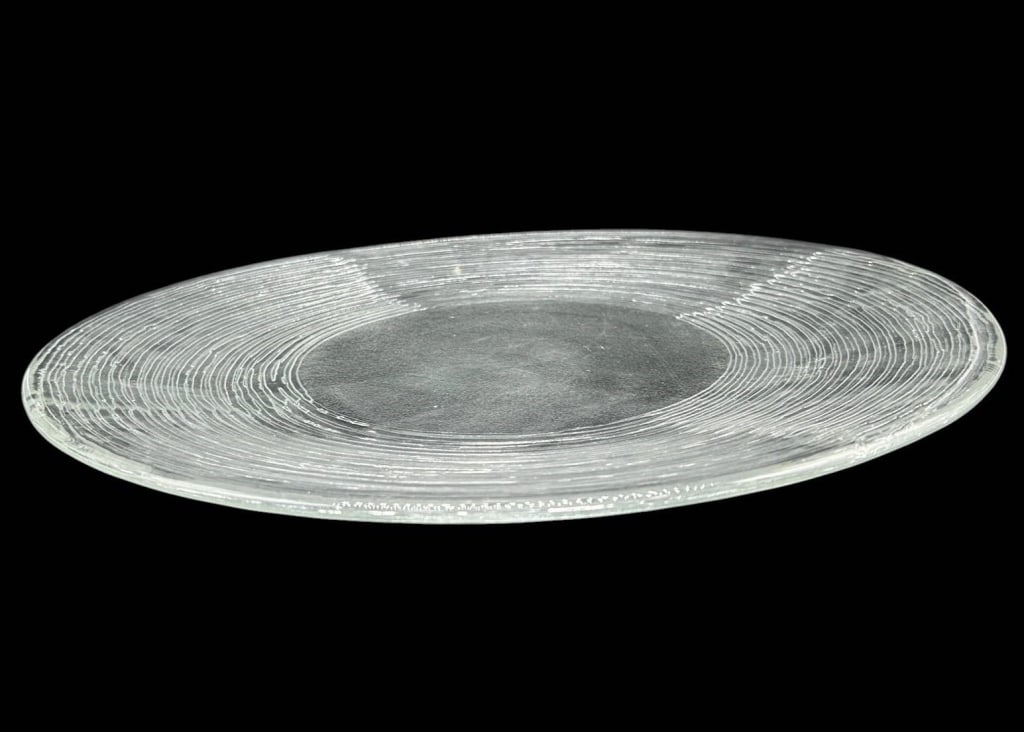 LARGE TEXTURED CLEAR GLASS CHARGER PLATE 16": Large clear glass charger, centerpiece or serving plate featuring an elegant concentric ring design radiating around a broad smooth circular center. The heavily textured linear surface creates attract