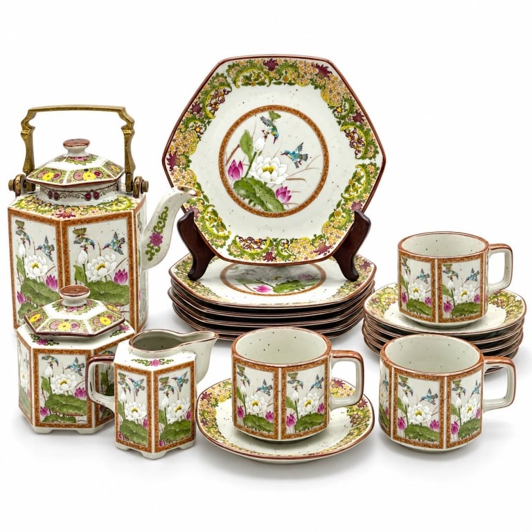 VINTAGE TOYO MING LOTUS JAPANESE TEA SERVICE 8": Vintage Toyo Ming Lotus Japanese tea service decorated with colorful birds among white and pink lotus blossoms, green foliage and ornate floral scrollwork. Faceted forms feature warm ochre borders, br