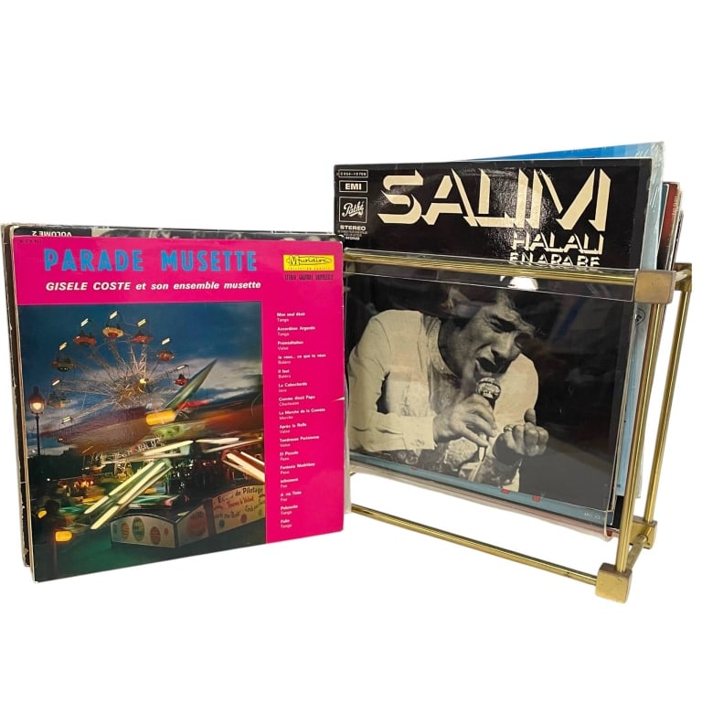 40 VINTAGE VINYL RECORDS W LUCITE BRASS STAND: Eclectic estate collection of approximately 40 vintage vinyl records offered together with a stylish Mid-Century Modern record stand. The collection includes an international assortment of vocal, popu