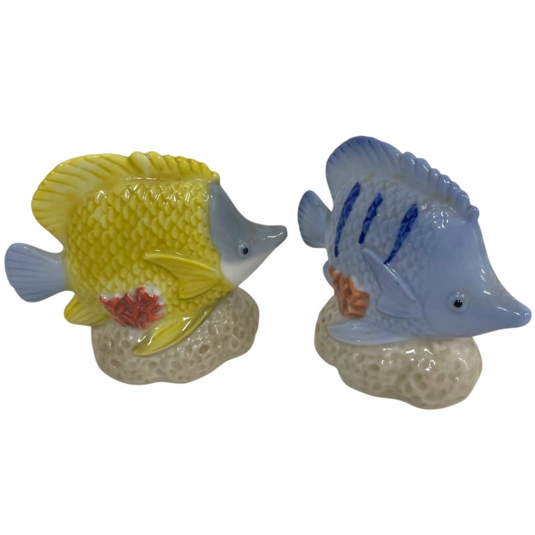 PAIR TROPICAL FISH PORCELAIN SHAKERS 3": Charming pair of figural porcelain tropical fish shakers featuring colorful glazed finishes in sunny yellow and soft blue. Each fish is modeled with textured scales, dimensional fins and tail, pointed
