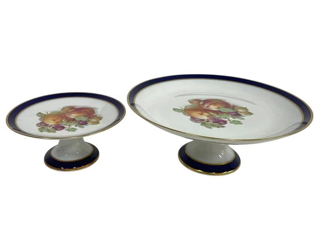 2 PORCELAIN CAKE STANDS W FRUIT MOTIF: PAIR OF PORCELAIN CAKE STANDS W FRUIT MOTIF & COBALT BORDERS | -Very good pre owned condition | -This matching set includes one larger and one smaller stand, perfect for serving, display, or as refine