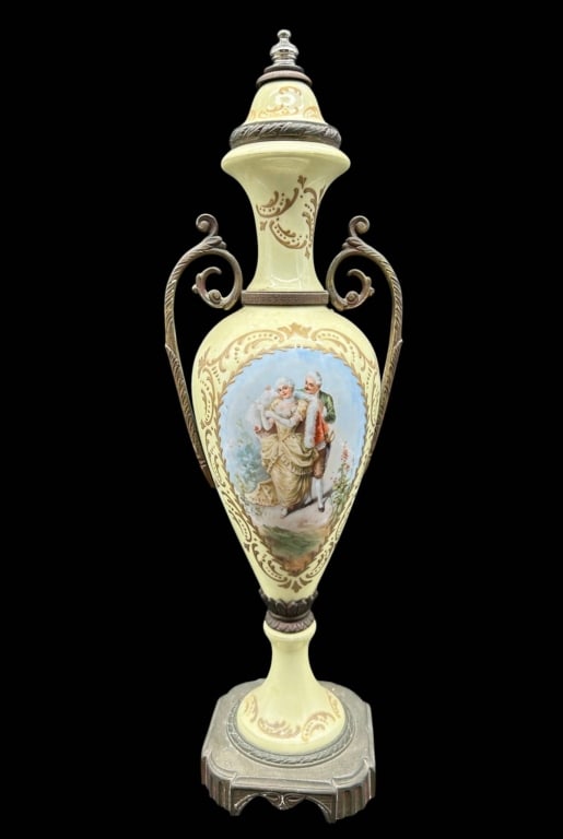 ANTIQUE PORCELAIN FIGURAL URN VASE 16": Elegant antique Continental porcelain urn-form vase with a tall, slender baluster body, pedestal base and elaborate scrolling metal mounts. The pale yellow porcelain is richly decorated with gilt scro