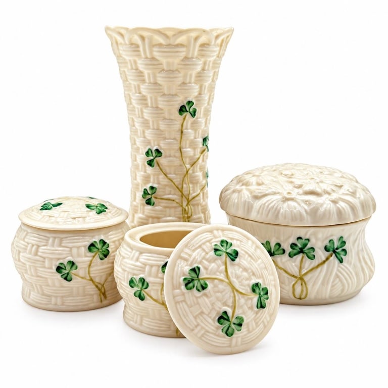 BELLEEK SHAMROCK VASE & 3 COVERED BOXES 5.5": Charming four-piece Belleek Ireland assortment featuring creamy ivory glazed porcelain with green shamrock decoration. Includes a slender Colleen vase with molded basketweave texture and scalloped rim