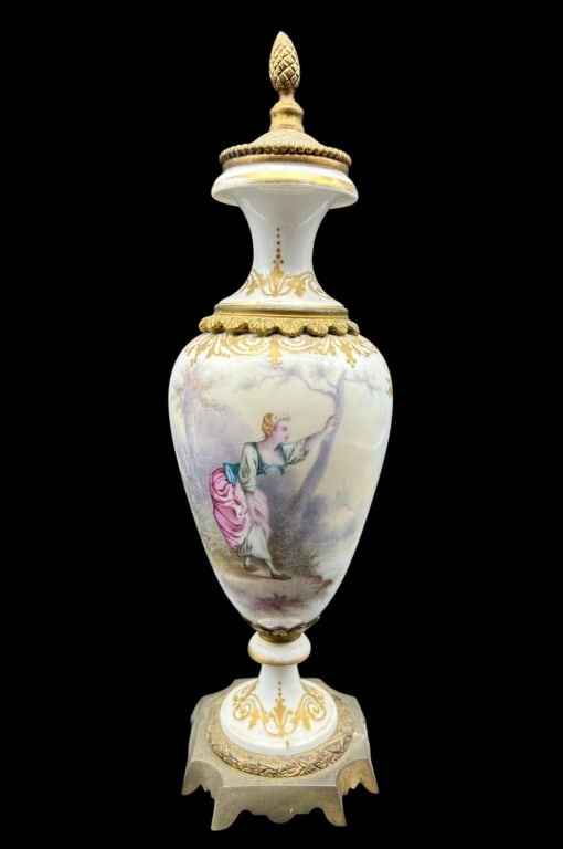 ANTIQUE PORCELAIN FIGURAL URN W BRONZE 12": Elegant antique Continental-style porcelain covered urn featuring a hand-painted romantic figural scene of a young woman in period dress within a softly rendered pastoral landscape. The elongated porc