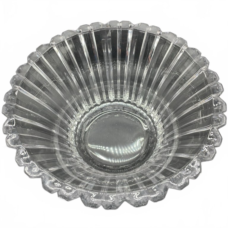 Scalloped Clear Glass Fluted Bowl: Clear glass bowl featuring vertical fluted lines and scalloped rim. The bowl is sturdy with a thick base, and measures approximately 4 inches tall. Ideal for serving or display purposes. | | | Rack 42