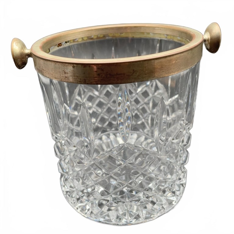 Cut Glass Ice Bucket With Metal Rim and Handles: Clear cut glass ice bucket featuring a solid metal rim and two side handles. The bucket displays a crosshatch and fan pattern, with a starburst design on the base. | | | Rack 42