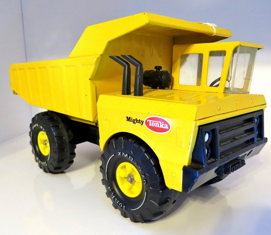 Tonka Mighty Dump Truck Great Color and Stickers Yellow: Tonka Mighty Dump Truck Great Color and Stickers Yellow XMB 975 some Pin Dings in Bed and edge scuffs and all Functions glass is clean scratch free no cracks stamped Steel Pressed Measures 19” long 
