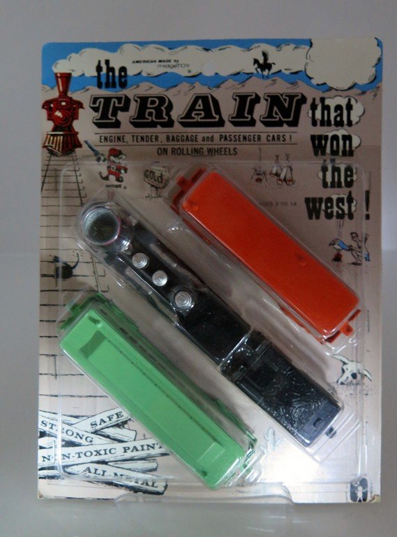 RARE Midge Toy The Train That Won the West New in: RARE Midge Toy The Train That Won the West New in Package Never opened Set Engine tender baggage and passenger cars on rolling wheels Mint