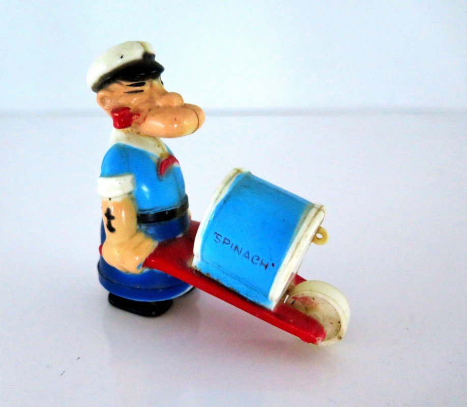 Popeye Ramp Walker with Wheel Barrow marked “Spinach” –: Popeye Ramp Walker with Wheel Barrow marked “Spinach” – Functional – No Cracks – Good Paint - Made in Hong Kong – Measures 2 ¾” Tall