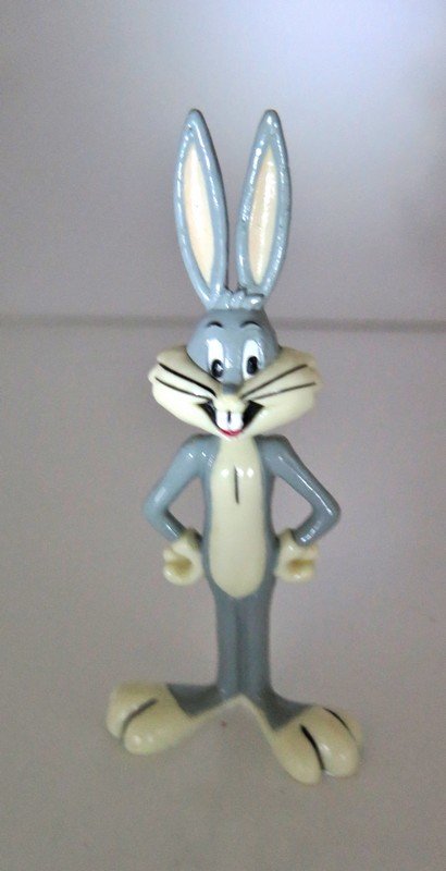 1990 Bugs bunny toy TM & Co Made in China Warner Bros: 1990 Bugs bunny toy TM & Co Made in China Warner Bros Standing with Arms on Hips RARE Figurine 4”1/2 tall and 2” wide