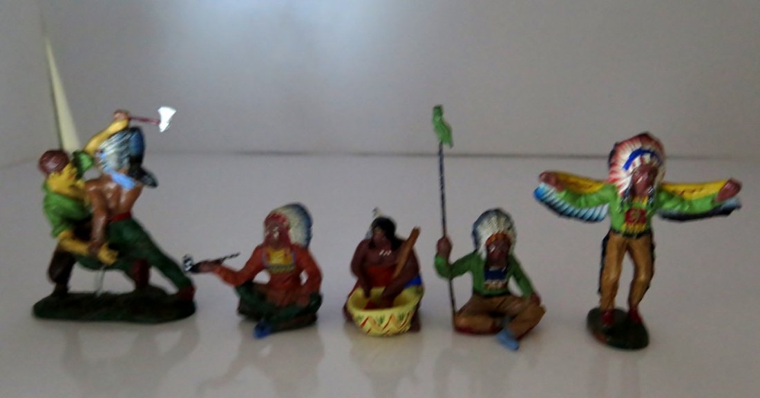 (5) Elastolin Composition Native American Figurines: (5) Elastolin Composition Native American Figurines made in Germany – Figurines Depict Dancing, Chief Passing Peace Pipe, Battle Scene, female making food & sitting with flag – Dancing Native Amer