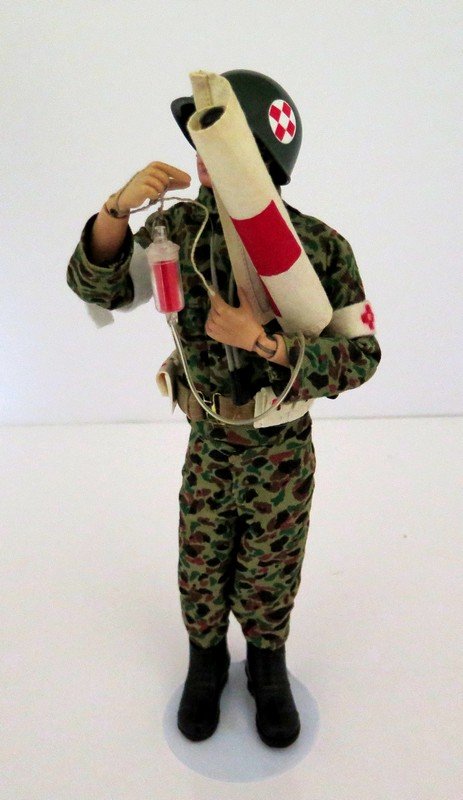 Original G.I Joe Ca. 1960’s Marine Medic with: Original G.I Joe Ca. 1960’s Marine Medic with Accessories – Comes Complete with Arm Band, Medic Flag, Stethoscope, IV, Helmet, Boots – Near Mint – No Noticeable wear or tear – Measures 12”