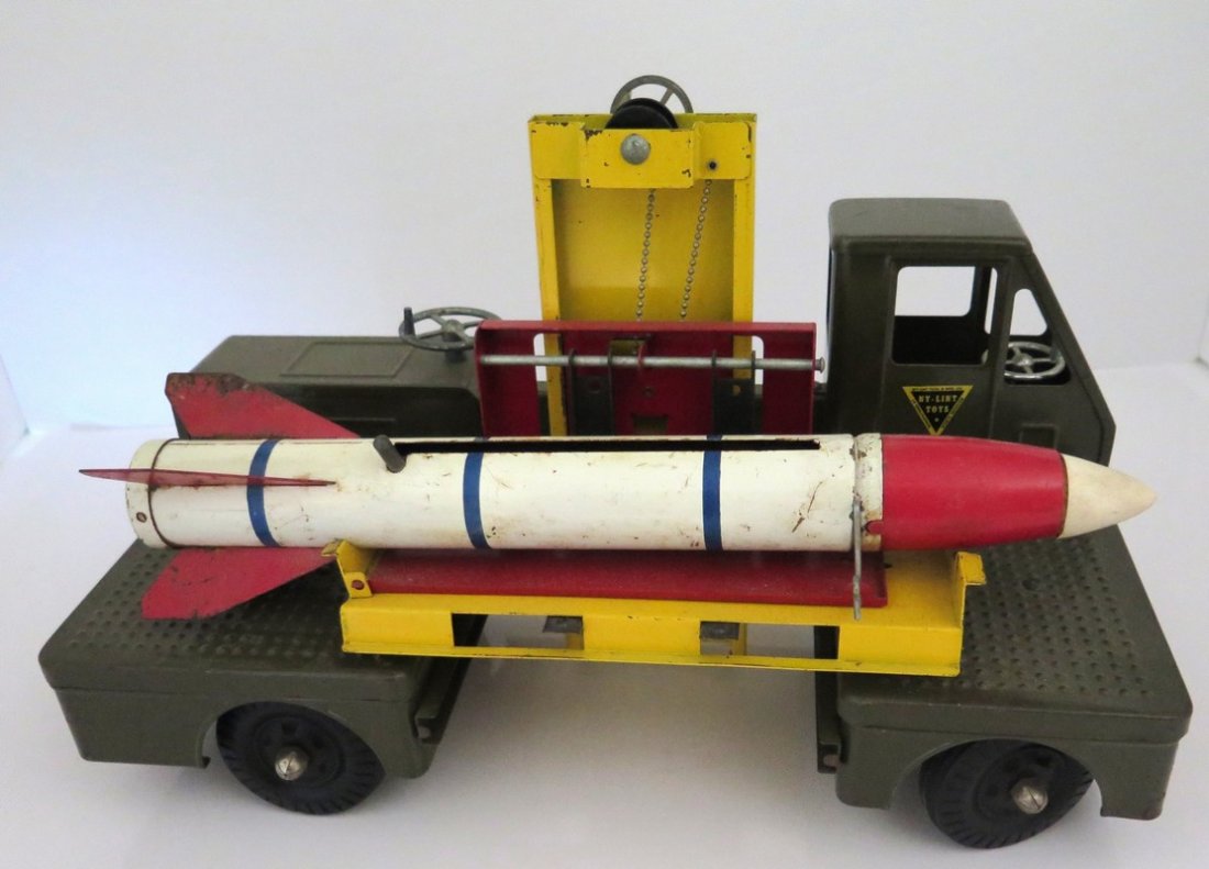 Original Ca. 1950’s Nylint Guided Missile Carrier: Original Ca. 1950’s Nylint Guided Missile Carrier “Travel Louder” - Fully Functional Crank That Raises Missile to Stand and Fire Rocket Tip – Spring Loaded – Includes Rocket (Very Rare) – 