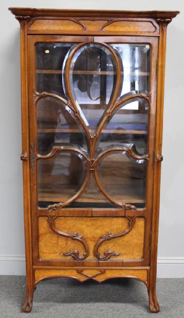 Art Nouveau Maple and Mahogany Cabinet.: A beautiful cabinet with wonderful fretwork and original patina. From an East 87th St., NYC estate. - Dimensions: 59" h x 30.5" w x 15.5" d.