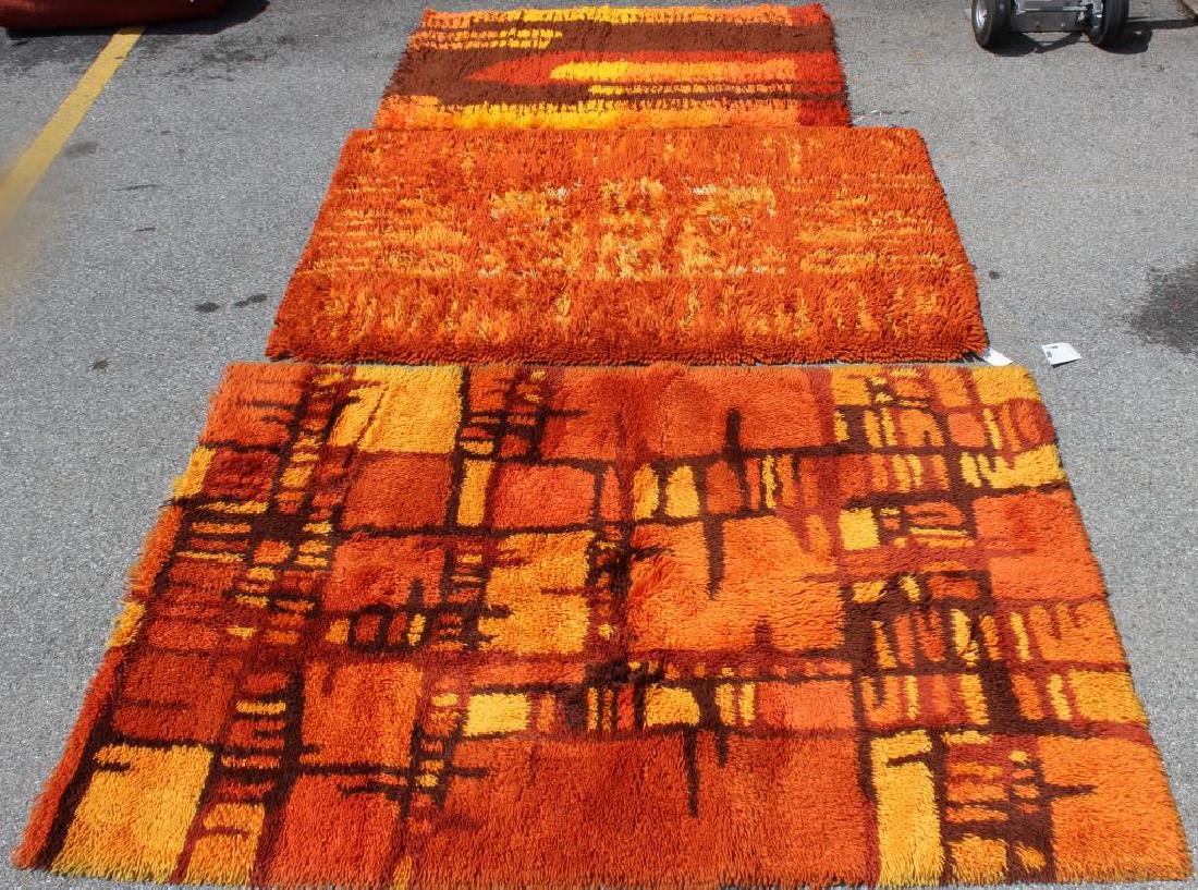Lot of 3 Midcentury Ege Rya Area Rugs.: Nice warm colors and period designs. From a Harrison, NY home. Dimensions: 5' x 3'4"; 6' x 4' and 6'5" x 4'8."