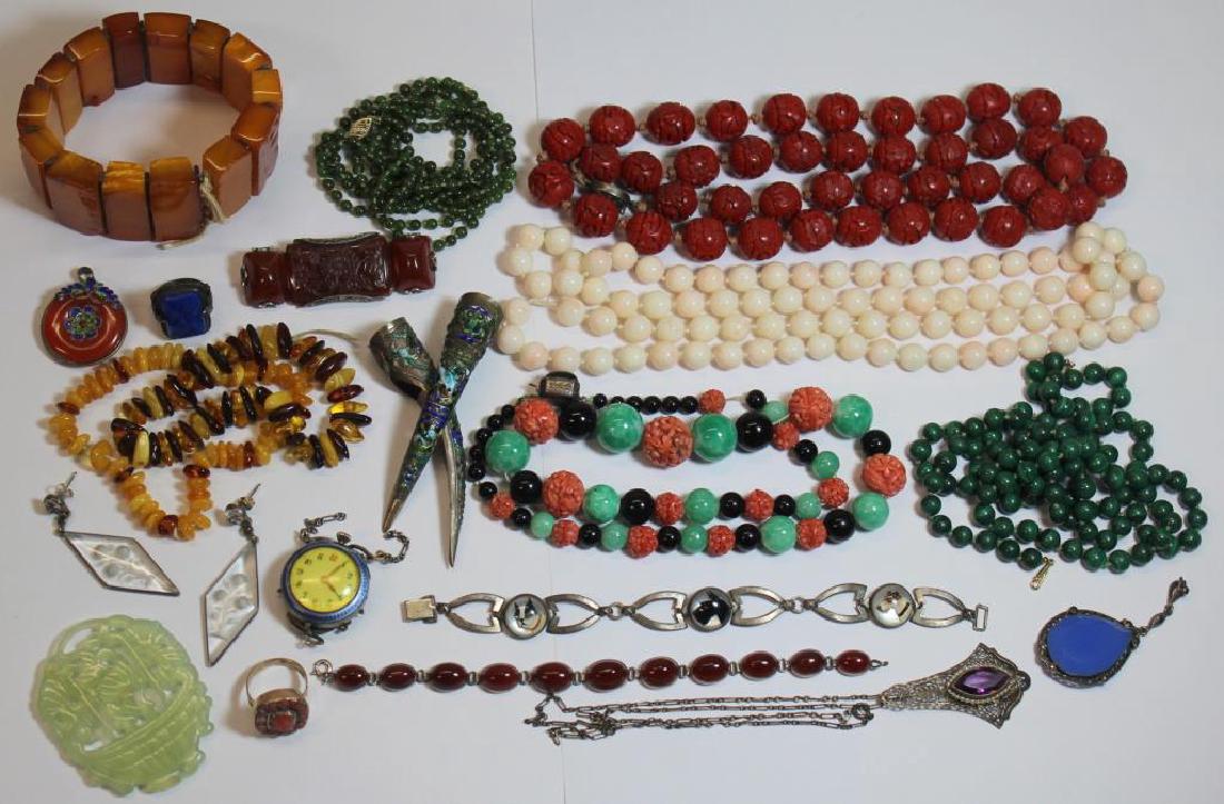 JEWELRY. Unique Vintage and Antique Jewelry.: Includes 2 butterscotch and baltic amber beaded bracelets; a carved jade pendant; a 9 ct gold and coral ring, size - 6 1/4; a Carnelian cabochon and silver bracelet; an Essex crystal or reverse painte