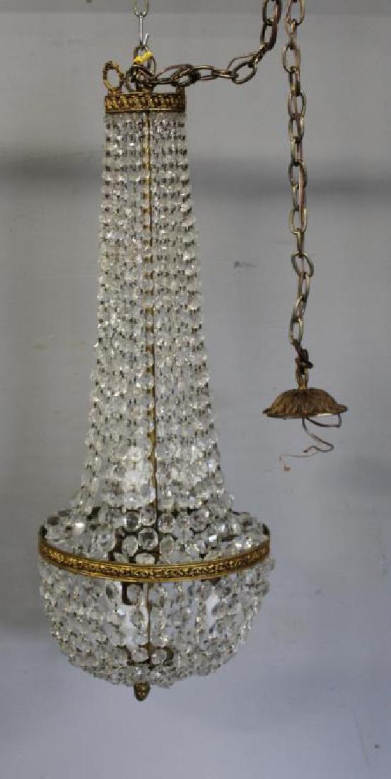 Balloon Form Gilt Metal and Crystal Chandelier.: From a Harrison, NY estate. Dimensions: 14" w x 39" h.