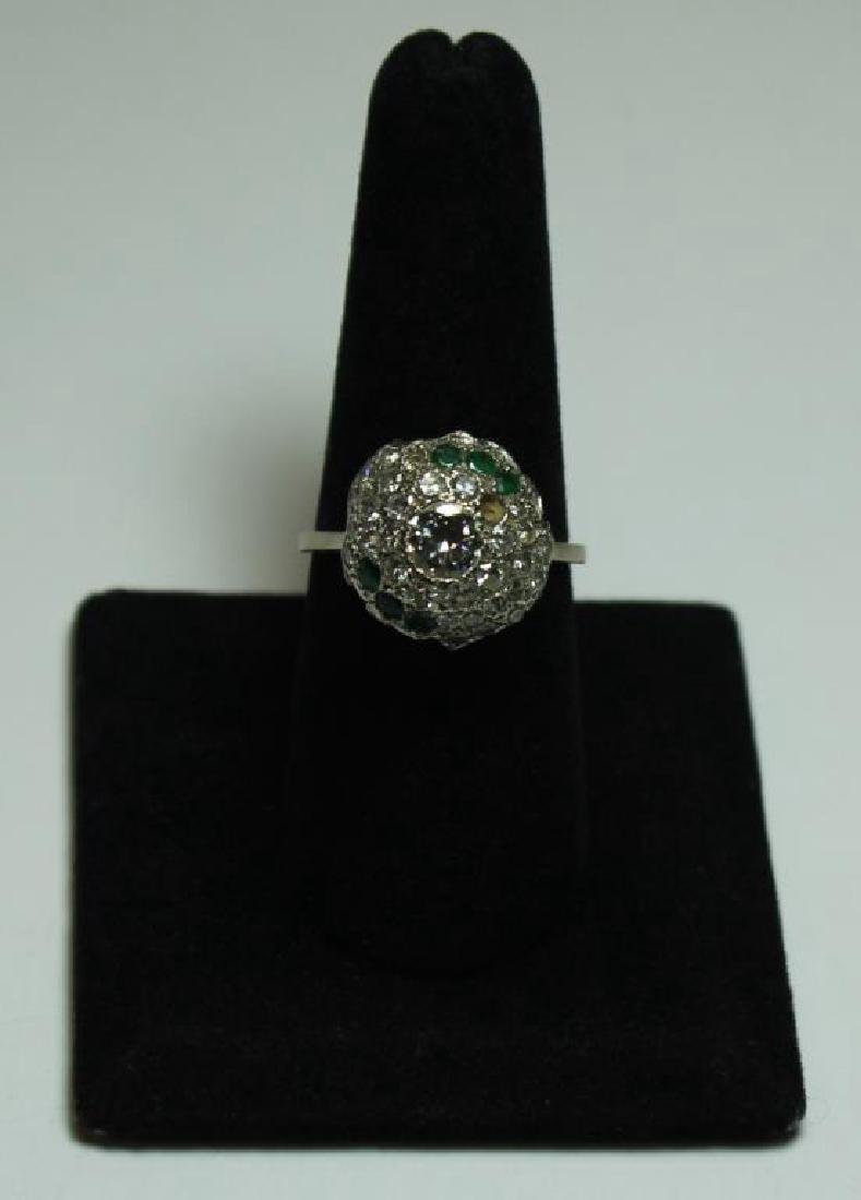 JEWELRY. Diamond and Emerald White Gold Ring.: According to a 12/29/12 National Appraisal Consultants LLC appraisal this ring contains "31 diamonds, 1 round brilliant cut, and 20 round single cut; estimated total weight is 1.26 cts (center stone 0