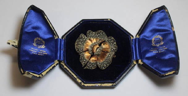 JEWELRY. Mario Buccellati 18kt Gold and Diamond: Brooch. Beautiful Mario Buccellati ruffled edge 18kt gold brooch with openwork detailing set with diamond accents. With original Mario Buccellati jewelry case. Signed verso, "Italy, 96, 750, Buccellat