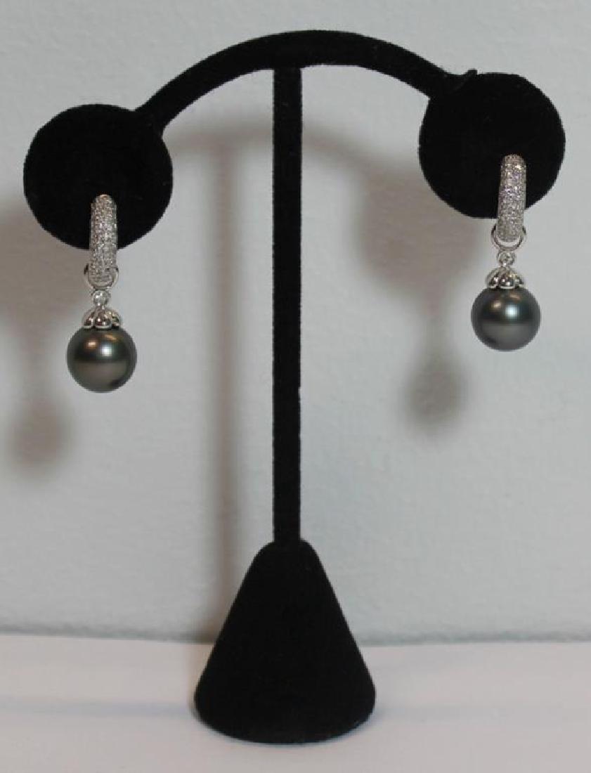JEWELRY. 18kt Gold, Pearl and Diamond Earrings.: 18kt white gold earrings inlaid with melee diamonds, and removable Tahitian pearl and diamond drops. Stamped, "750" to one earring, and, "D063" to the other. Pearls measure approx. 11 1/2mm each. Tota