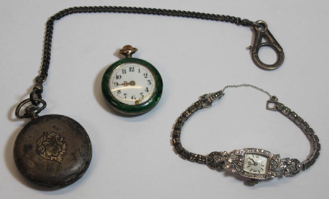 JEWELRY. Assorted Ladies Watch and Pocket Watch: Grouping. Includes a Tissot 14kt white gold watch face - with replaced sterling and marcasite watch band; a ladies green enamel pocket watch; and a monogrammed sterling Tiffany & Co pocket watch - no.