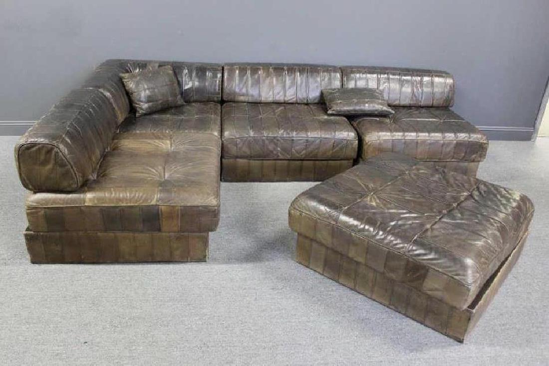 De Sede Leather Upholstered Sectional Sofa.: Includes 4 sections with removable backs, one ottoman section and 1 as is section lacking leather upholstery. From a Stamford, CT estate. Dimensions: each section approximately 36" x 36", the 4 sectio