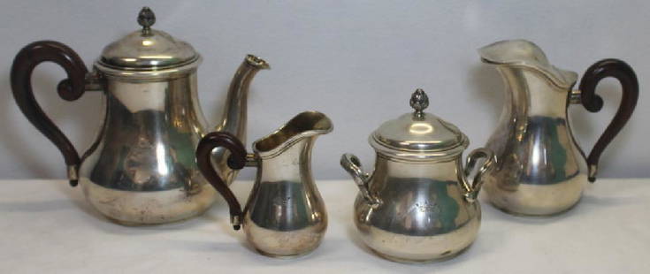 SILVER. French .950 Silver Robert Linzeler Tea: Service. Includes a teapot, covered sugar with gold wash to interior, diminutive creamer with gold wash to interior, and creamer with hinged lid. Lidded items with acorn form finials; 3 pieces with wo