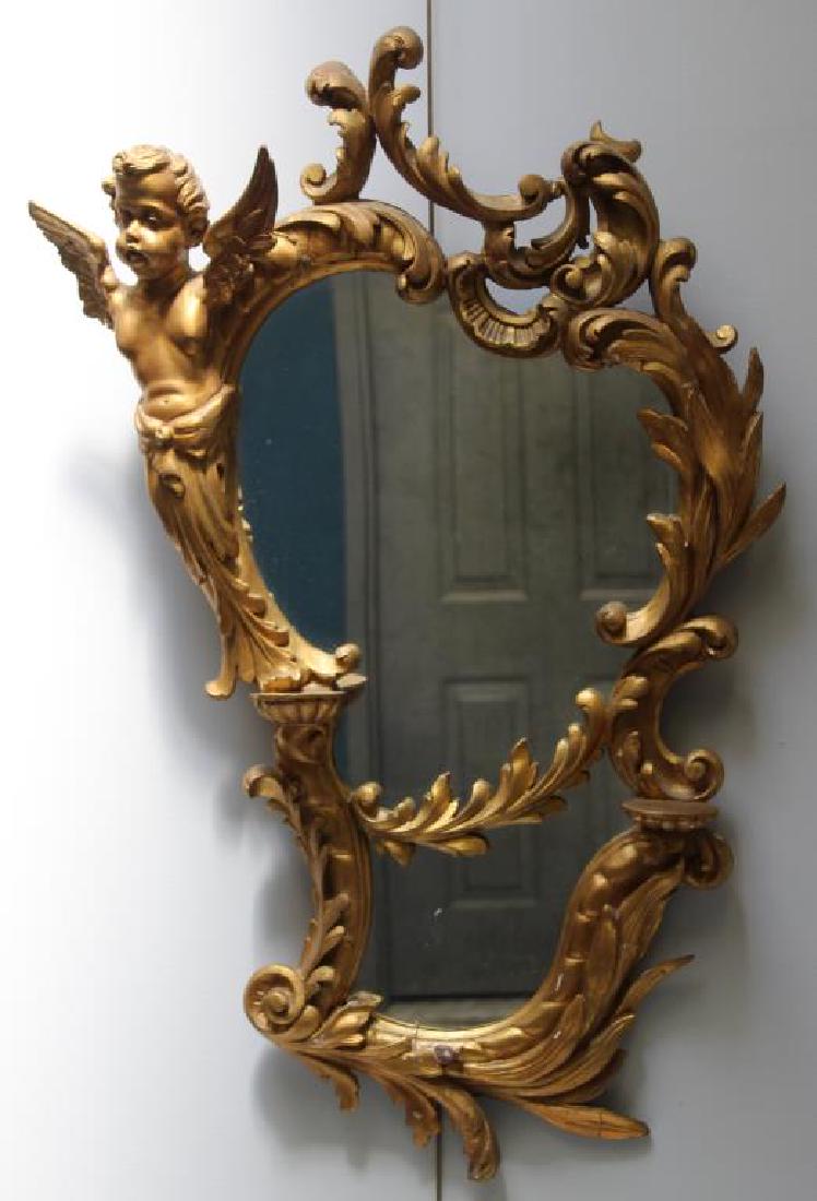 Antique Carved and Giltwood Mirror With Angel: Decoration. From a Queens estate. - Dimensions: 42" x 22".