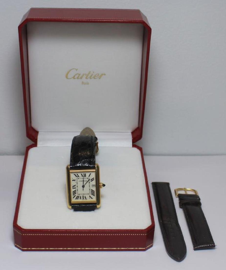 JEWELRY. Men's Cartier 18kt Gold Tank Watch. (1 of 12)