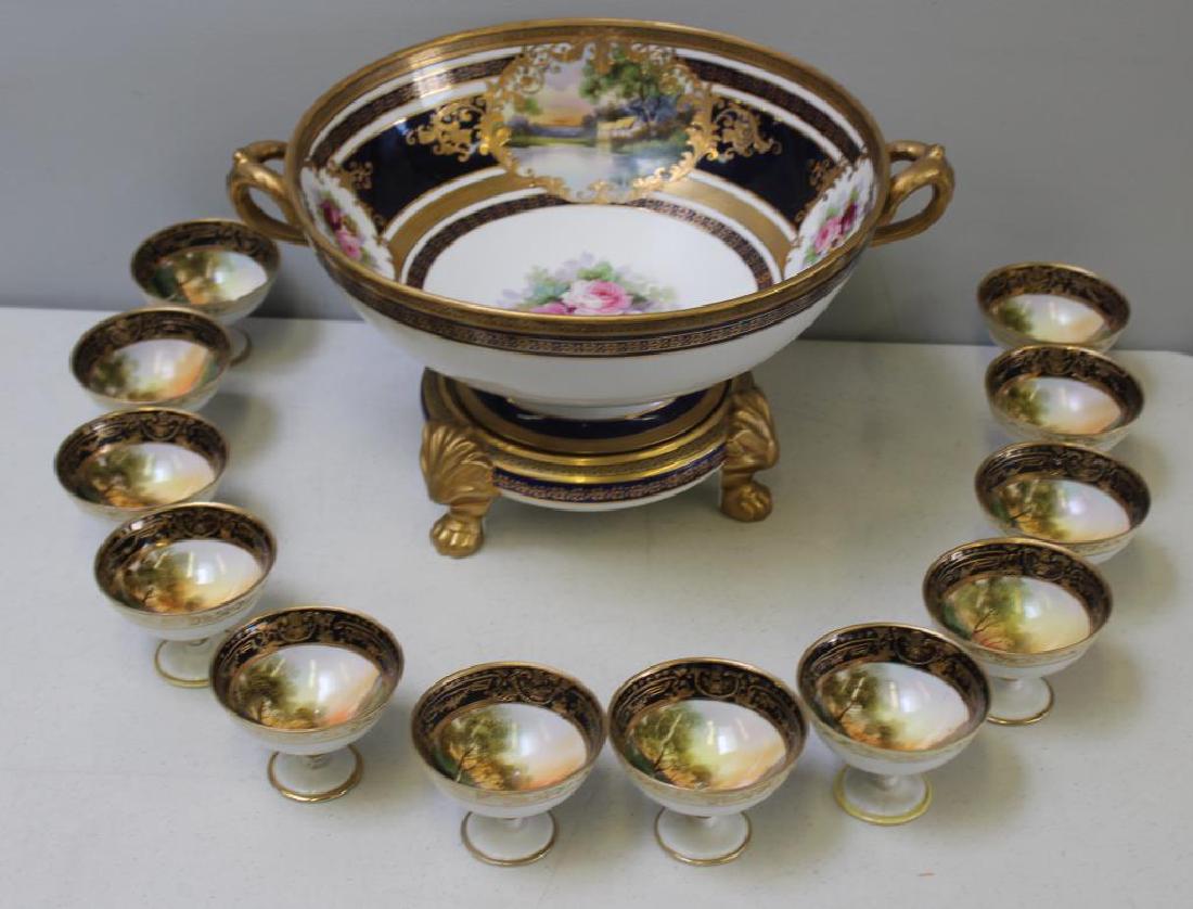 NORITAKE. Punch Bowl and Cups.: A center bowl and stand with 12 cups. From a New Rochelle estate. Dimensions: bowl with stand - 13" diameter x 9.5" h.