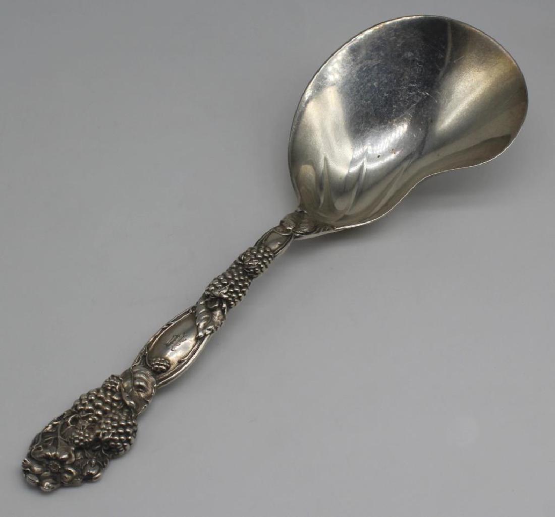 STERLING. Tiffany & Co. "Blackberry": Tiffany & Co. monogrammed "Blackberry" berry casserole spoon. Stamped, "Tiffany & Co, Makers, Sterling". Total approx. weight is 3.98 troy oz. From a Manhattan, NY estate. 