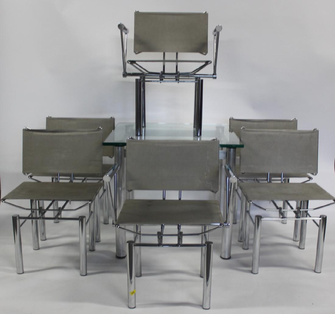 Hans Ullrich Bitsch Chromed Steel and Mesh: Series 8000 Chairs and a Table. From a 605 Park Ave, NYC estate.Dimensions: Table: 29" H x 32" squareChair with Arm: 25" x 21 1/2" x 32" HSingle Chair: 20 1/2" x 21"