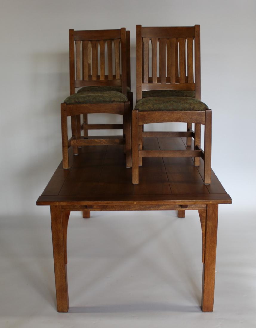 Stickley Audi Signed Oak Arts & Crafts Style Table: & Chairs. From a Hastings on Hudson estate. Dimensions:Table: 42 1/2" x 72" x 30" HChair: 18 1/2" x 22" x 39" H