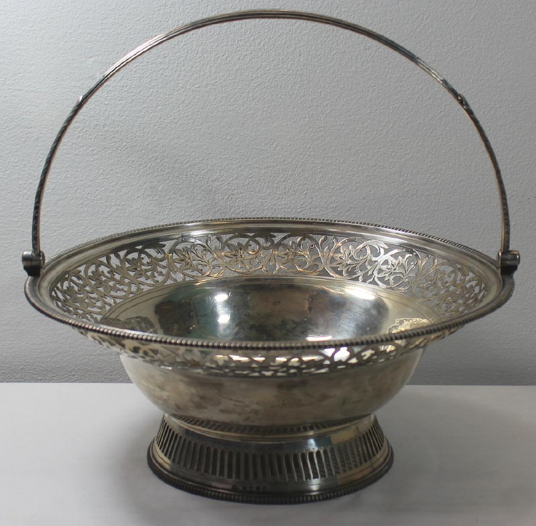 SILVER. King George III English Silver Basket.: Early 19th century English silver pedestal basket with reticulated border with floral and scroll motif. Stamped to rim of pedestal base with London city stamps, maker's mark of William Allen III, date