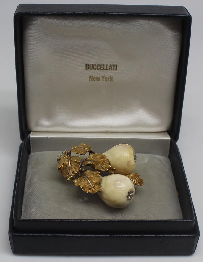 JEWELRY. Buccellati 18kt Gold and Carved Pear: Brooch. Buccellati Italian 18kt yellow gold foliate form brooch with (2) carved pears. Stamped verso, "Italy-18K" with further inscription of, "Buccellati". Total approx. weight is