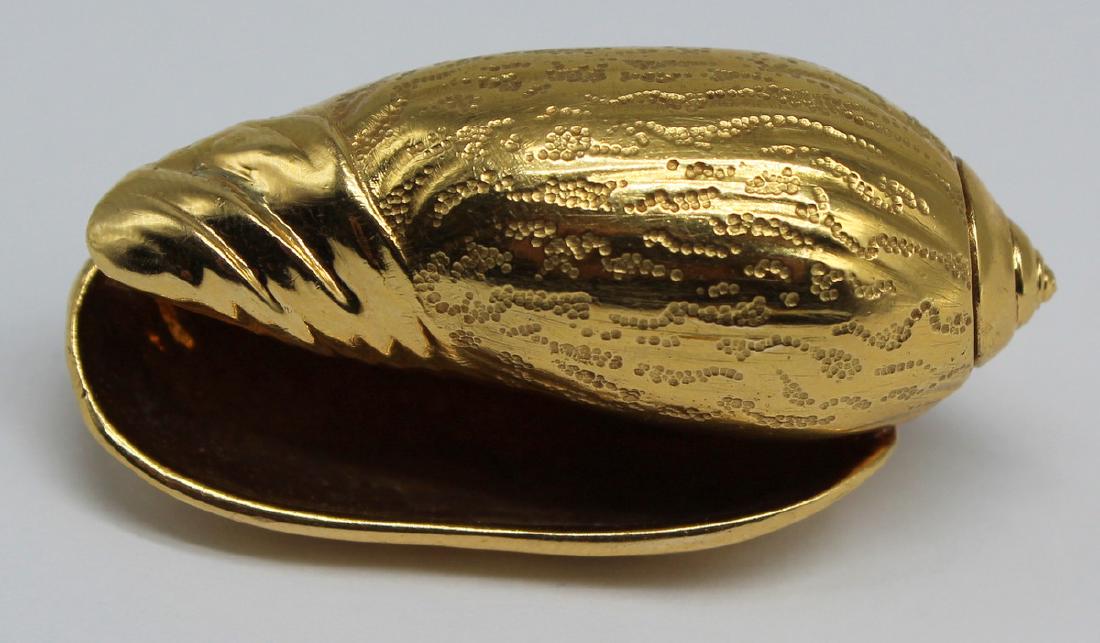JEWELRY. Hermes 18kt Gold Shell Form Brooch.: Hermes 18kt yellow gold olive shell form brooch with beautiful textural detailing. Stamped verso, "Hermes" with French .750 hallmark of an eagle's head, and additional unidentified mark. Tot