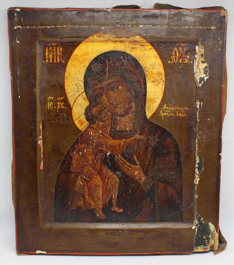 Russian Icon of Madonna and Child.: Painted Russian icon of Madonna and child. With losses. From a Greenwich, CT estate. - Dimensions: 12.5" h x 10.5" w.