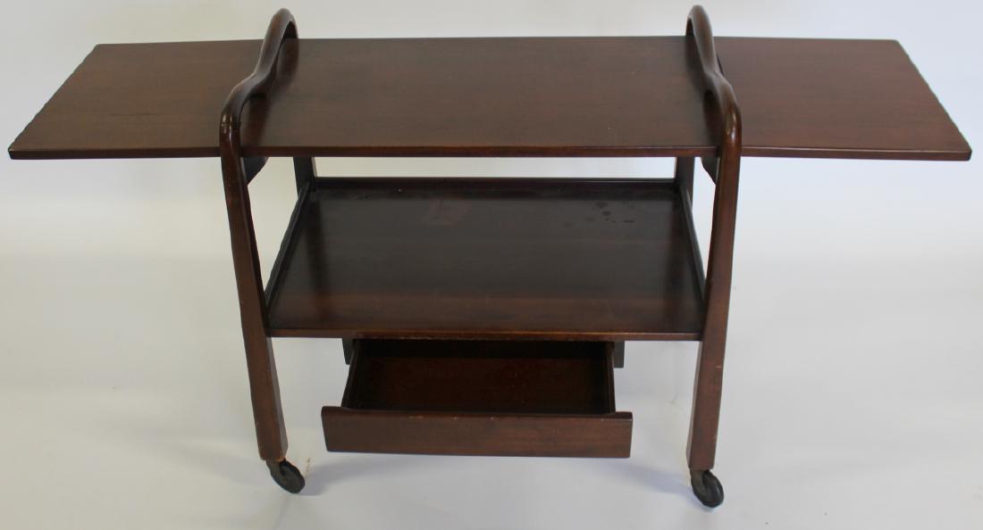 MIDCENTURY. Drop Side T Cart. Signed On Base: From a Larchmont estate. - Dimensions: 32" x 19" x 32"H drop 15"