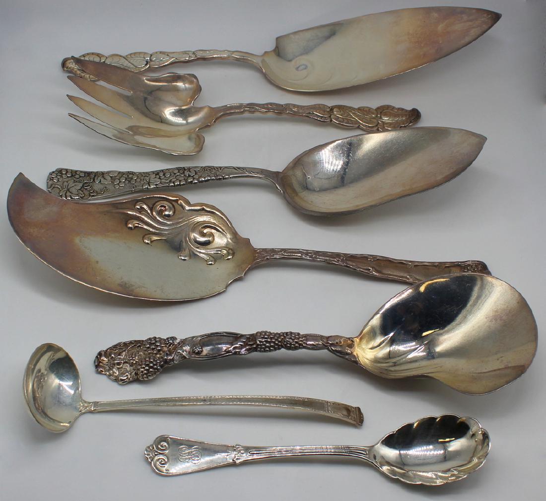 STERLING. (7) Assorted Tiffany & Co Serving Pcs.: Includes a Tiffany & Co Blackberry berry casserole spoon with kidney shaped bowl; a Tiffany & Co Wave Edge large solid ice cream server - approx. 11 3/8" in length; a Tiffany & Co San