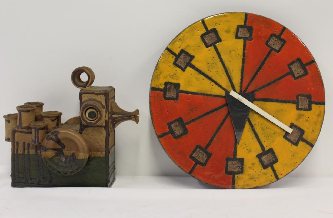 MIDCENTURY. Italian Glazed Pottery Clock Together: With A Signed Danish Sculpture. The clock Aldo Londi Bitossi, 14"dia and the sculpture 10" x 11" sgd on base. From a Scarsdale, NY estate.