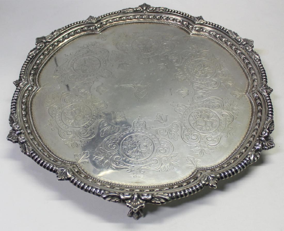 SILVER. Late 19th C English Silver Salver.: Late 19th century Goldsmiths & Silversmiths Co. English silver salver. London city stamps, date letter of 1897, and maker's mark of WG over JL in a shield form cartouche representing William Gibso
