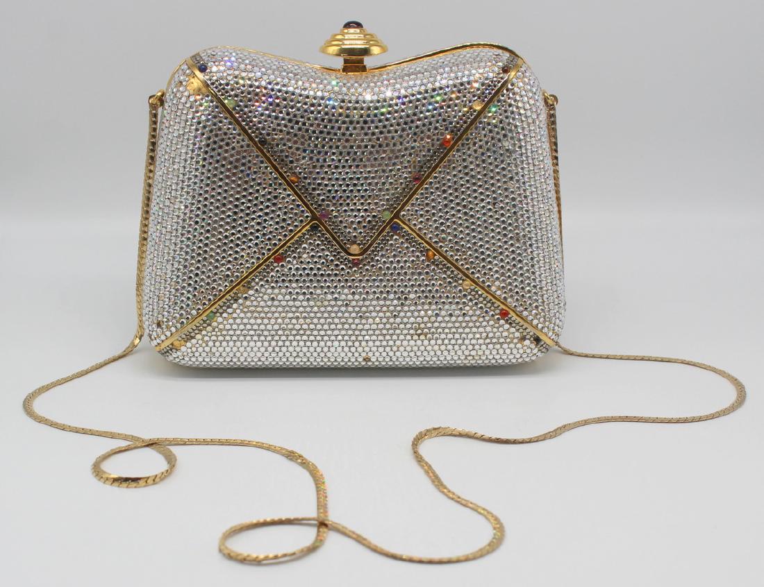 COUTURE. Judith Leiber Envelope Minaudiere.: Judith Leiber envelope form minaudiere with gem cabochon details. Multi tier gilt closure with red cabochon, and interior chain shoulder strap. Interior, "Judith Leiber" plaque. From a Larch