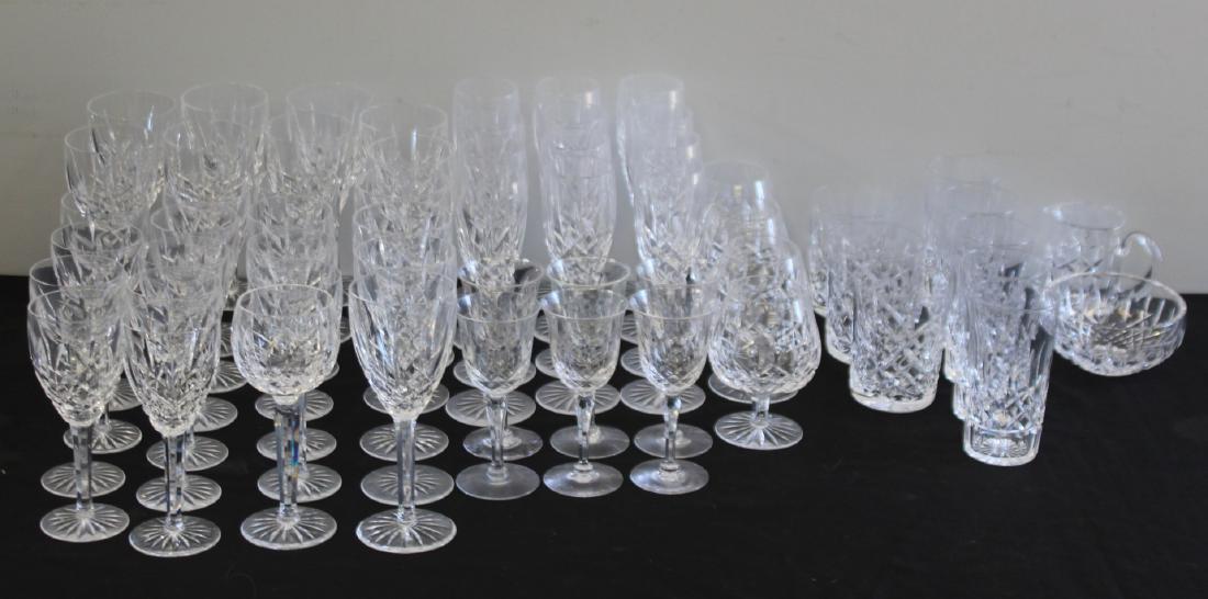 WATERFORD. Lot of Assorted Lismore Stemware: To include 5 tall glasses (5.75" h), 3 short glasses (4.5" h), 4 brandy sniffers (5.25" h), 6 desert wine glasses (6" h), 13 white wine glasses (7" h), 12 red wine glasses (7.75" h), 12 champagne flut