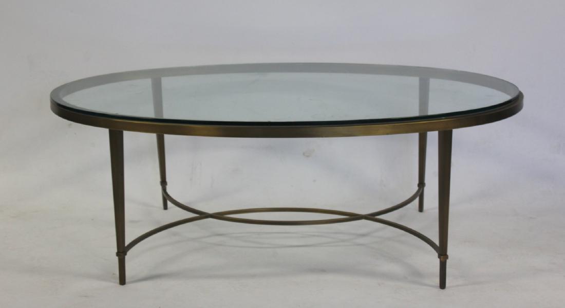 BAKER. Brushed Metal Oval Coffee Table.: A Baker Brushed Metal Oval Cocktail Table. "Chloe" table from the Thomas Pheasant Collection. From a Rye, NY estate. - Dimensions: 17" x 49" x 31"