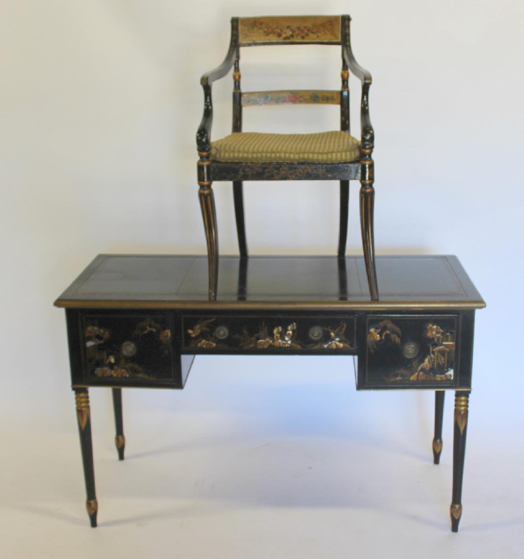 Sheraton Decorated Black and Gold Writing Table: Together with Chair. Oblong top with molded edge inset with gold - tooled black leather, flanked by 2 deep drawers; on ring turned tapering legs. Decorated in the Chinese manner in gold with figures i