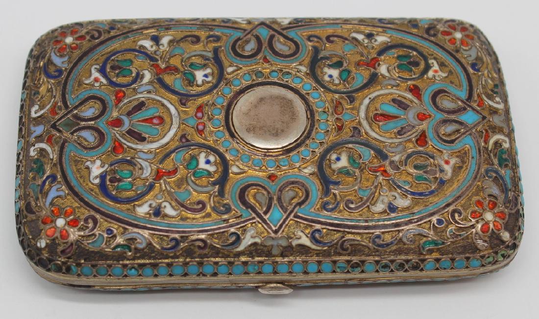 SILVER. Russian Enameled Silver Cigarette Case.: 19th century Russian gilt silver and enamel decorated cigarette case. Central cartouche to lid most surely replaced. Interior stamped with an unidentified maker's mark; assay master's mark of Aleksand